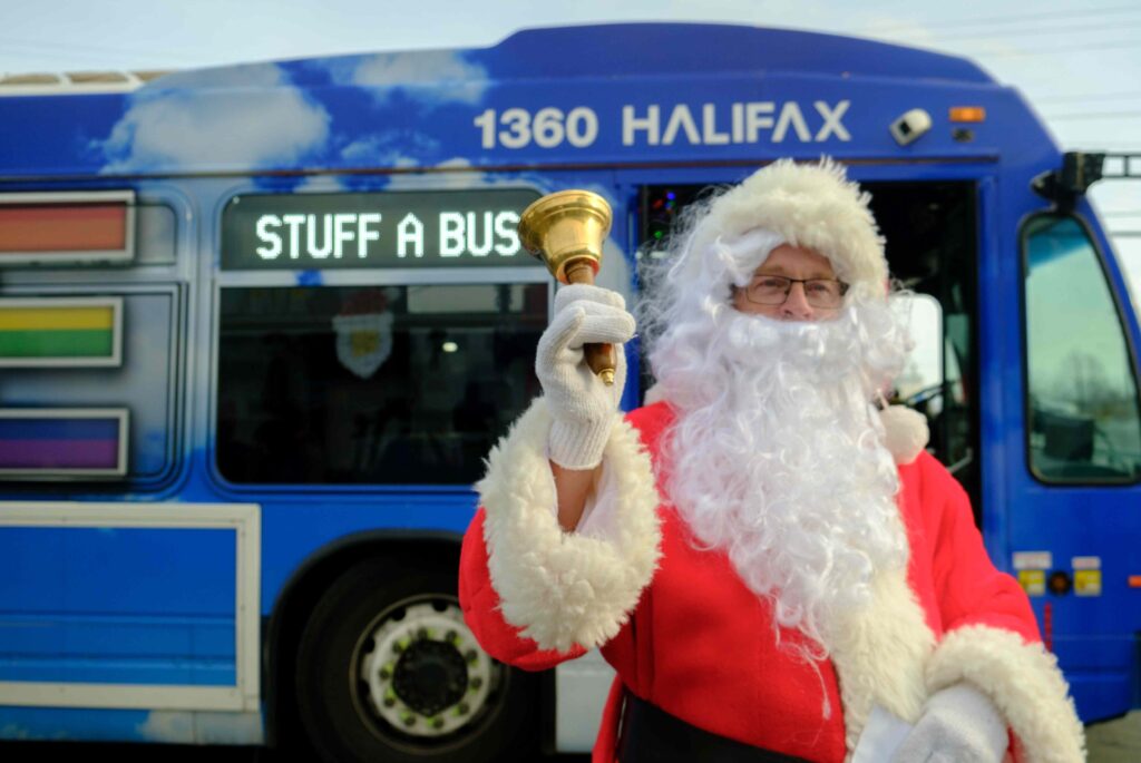 Santa in front of a Transit bus